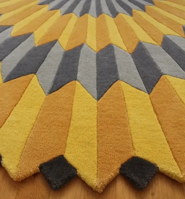 Close up to Annika Johansson's art painting "Rosette NY" as handmade rug in yellow and grey. Unique shape round rug.