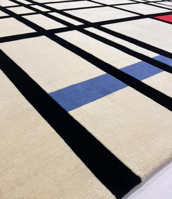 Närbild på handknuten skräddarsydd matta i ull efter Piet Mondrian Komposition med rött, gult och blått - 1