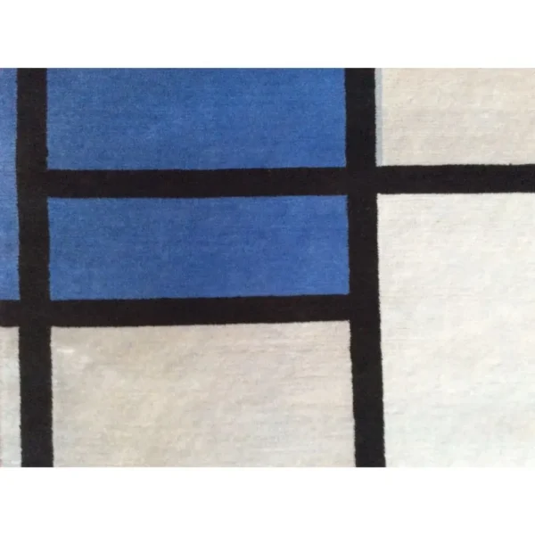 Primer plano de alfombra inspirada en Piet Mondrian «Composición con rojo, azul, negro, amarillo y gris», hecha a mano por encargo.