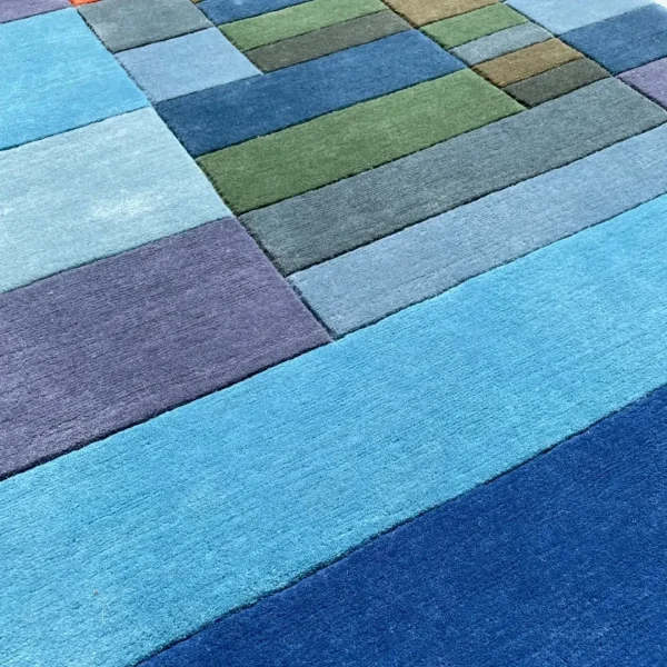 Close up to rug after Paul Klee "Fire in the Evening" custom handmade art rug
